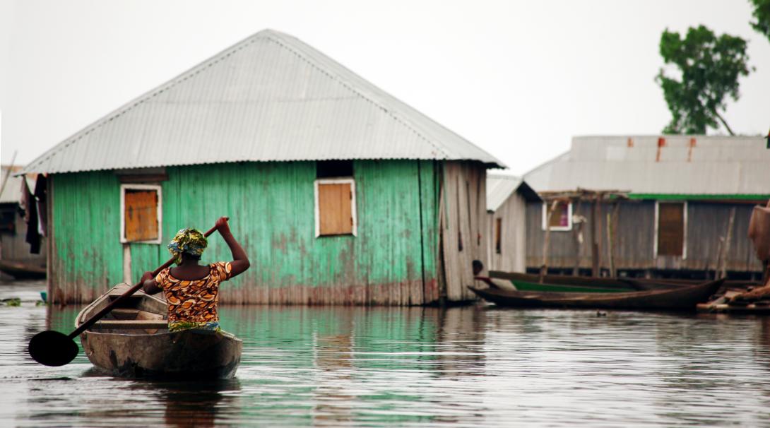 A woman is on her way to her home after the floods caused by cyclone Idai in Mozambique. Projects Abroad volunteers can help local communities in Mozambique at the disaster relief project set up after cyclone Idai.